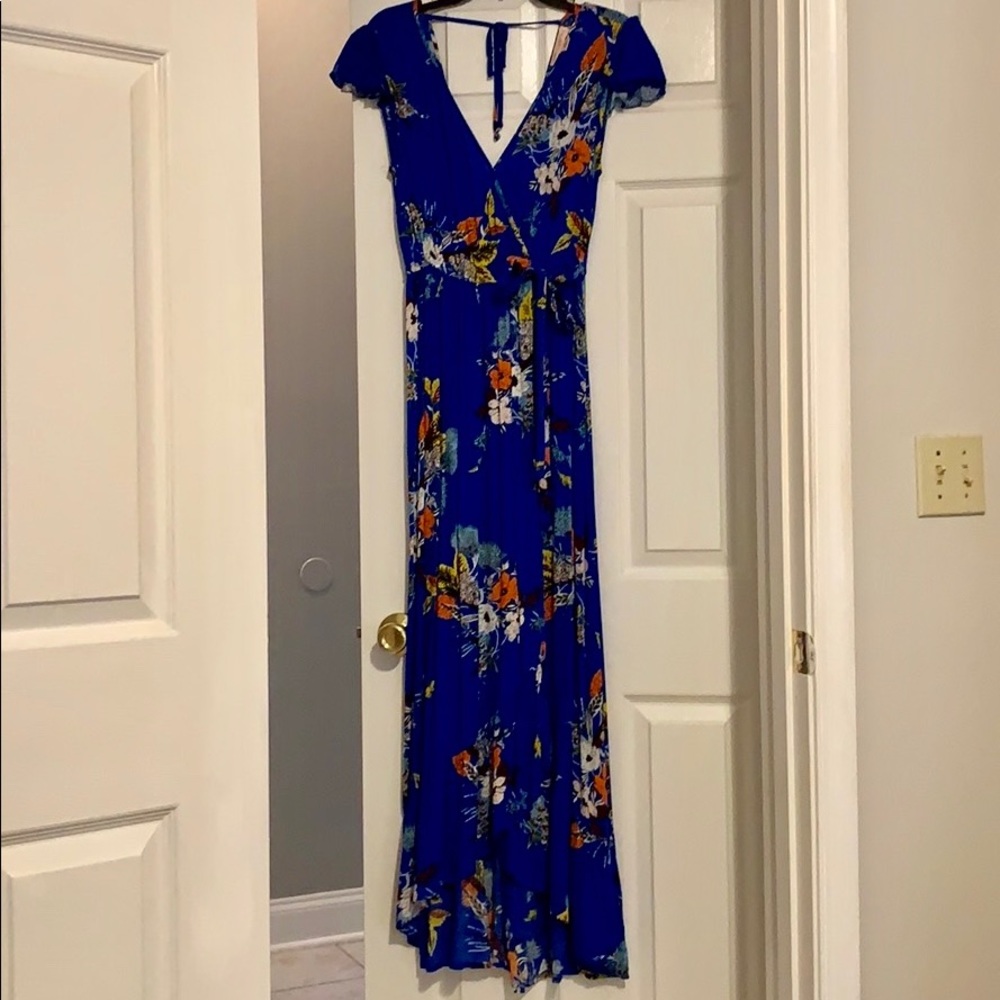 Vibrant cobalt blue wrap dress style .